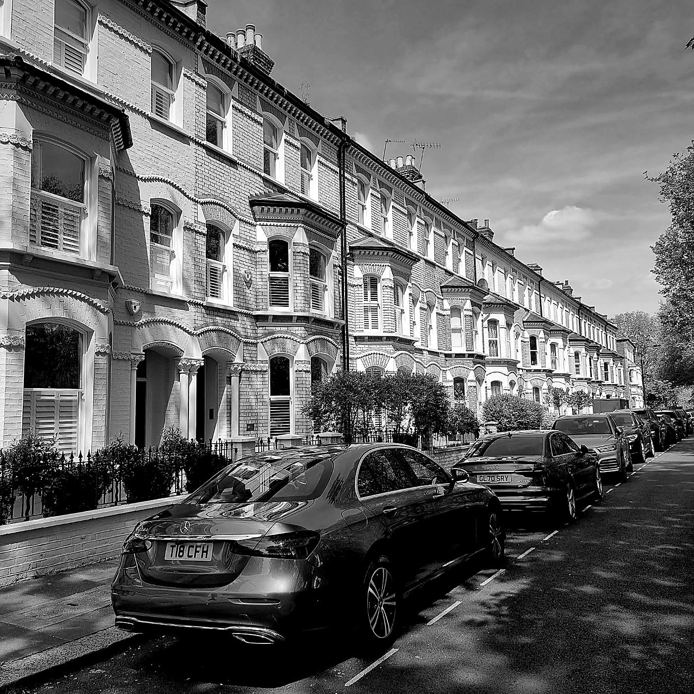 CFH Executive Chauffeurs Mercedes-Benz E-Class Saloon kerbside on a London terraced street